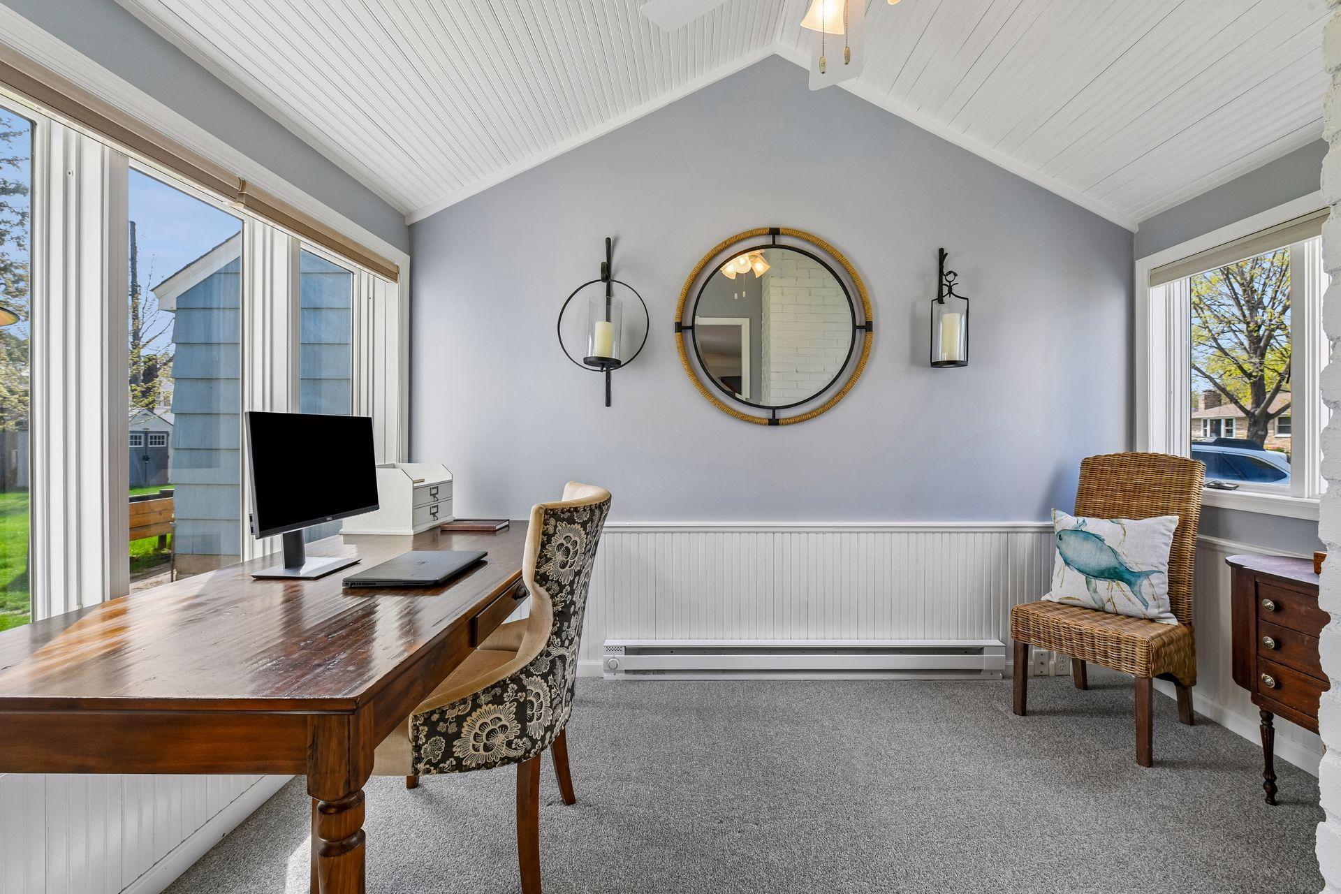 The inviting vaulted sunroom overlooks the backyard.