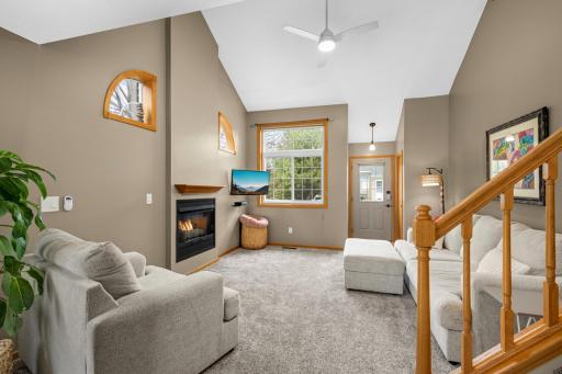 Updated & in immaculate condition! New carpet and fresh paint throughout the home. Vaults and cozy gas fireplace welcome you in your new home!
