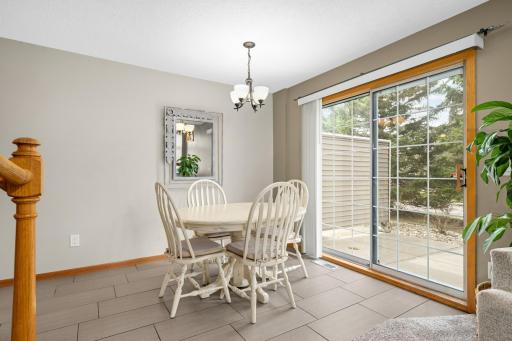 Spacious & inviting dining area with tile flooring. Sliding door leads to patio area. New outlets and switches throughout home! No details have been overlooked!