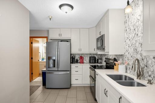 Spacious kitchen with nice stainless appliances & lots of room for meal preparation.