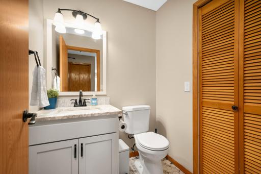 Convenient 1/2 bath on main level has also been updated! Utility room with new furnace!