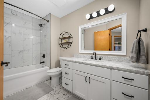 Lovely upper level full bath has been completely remodeled with new bathtub, tiled shower and floor, new vanity, sink, counter top, exhaust fan & faucet. Nice and large space to start your day!