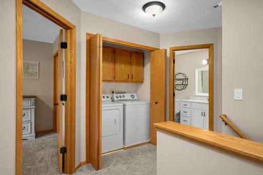 Upper level laundry with extra storage. Door handles and hinges have also been updated. No detail has been missed in this home.