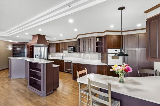 Custom maple kitchen cabinetry, new hardwood floors, plenty of space for gathering and entertaining.