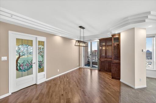 The stained glass entrance to the owner's suite. Note the custom built, lighted solid wood cabinets.