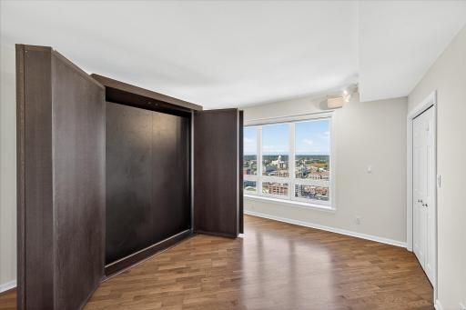 Voila! The doors open and the Murphy bed folds down.