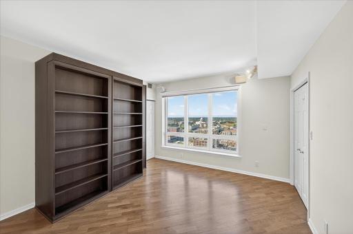 This custom bookcase in the 2nd bedroom opens into a queen size Murphy bed.