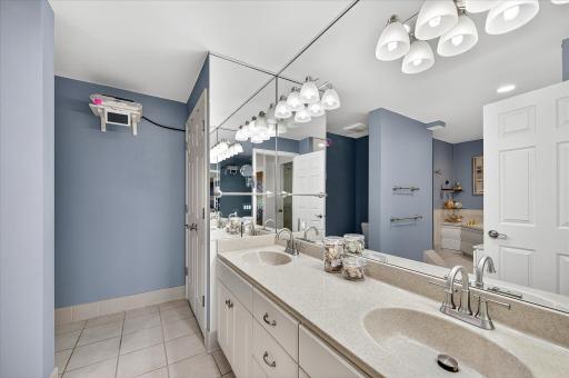 Owner's suite full bath with a divided area for the toilet, double sinks and both a jetted tub and separate shower.