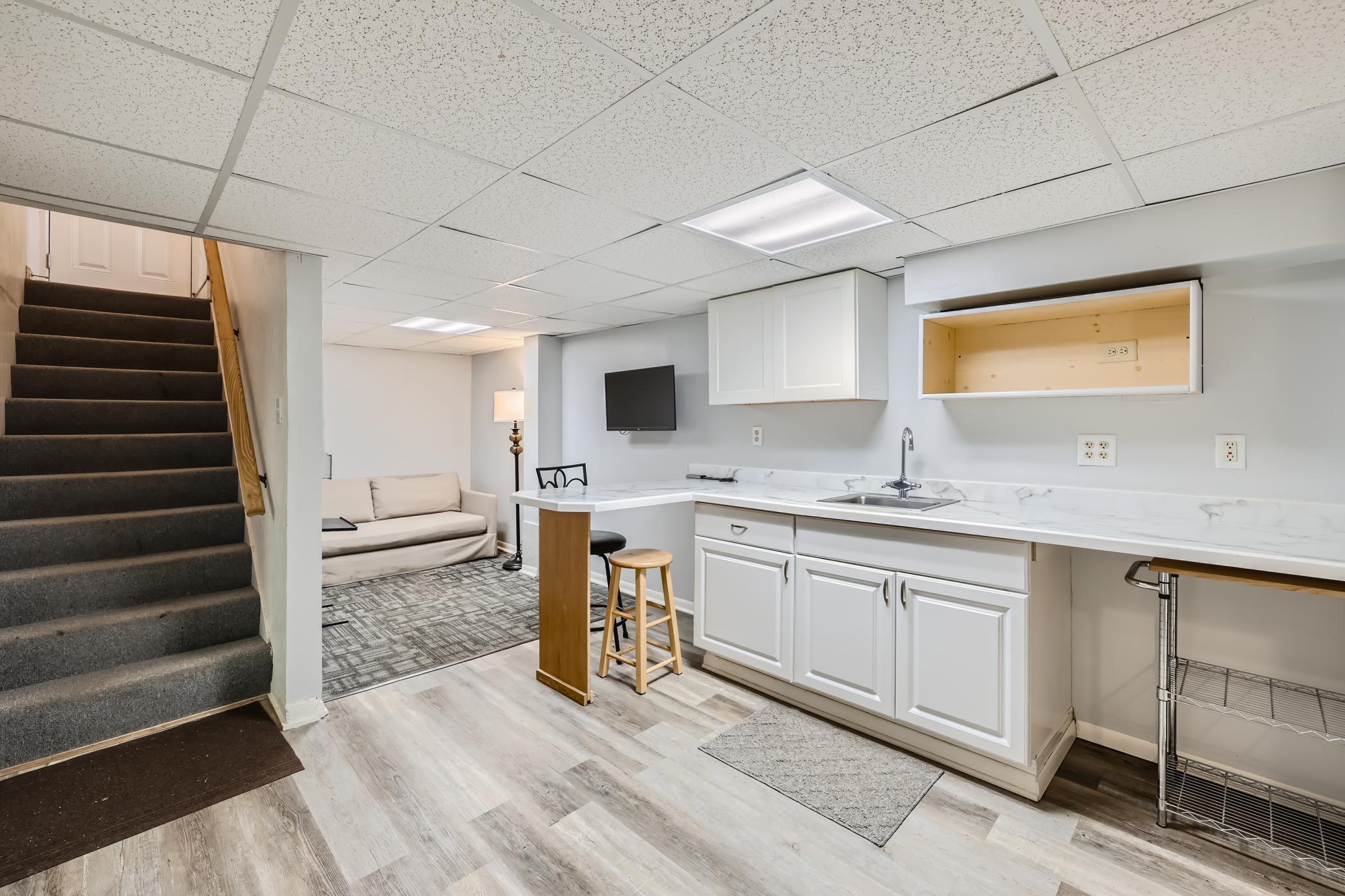 18 Lower Level TV Area and Wet Bar.jpg