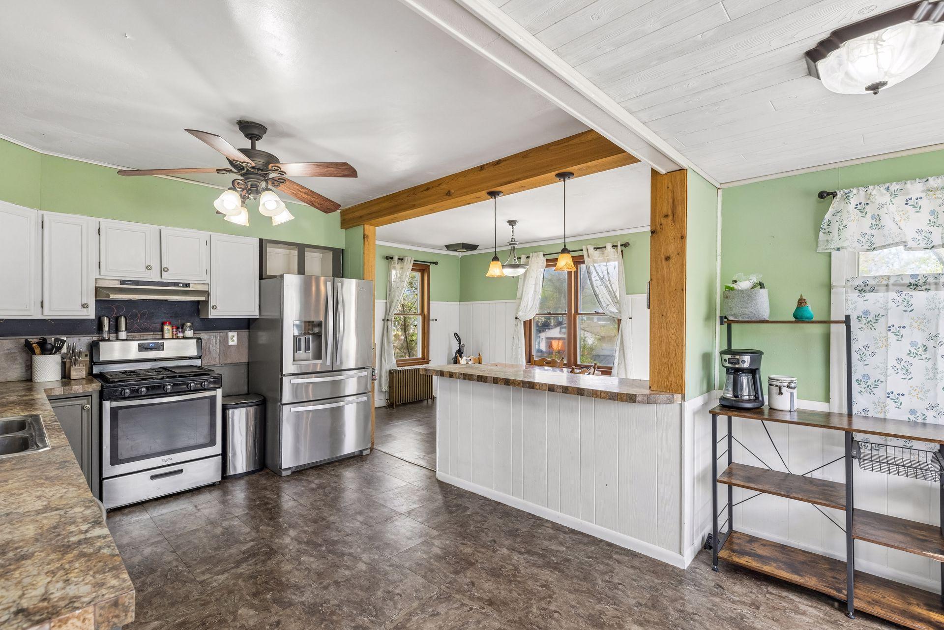 The kitchen boasts stainless steel appliances