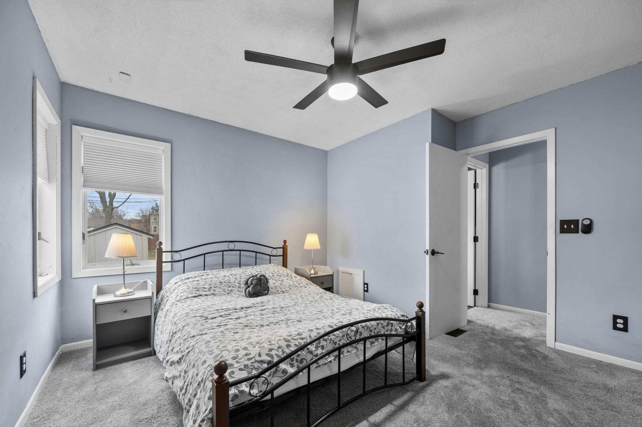 The second bedroom offers added privacy, a large closet with built-ins, and views of the side and backyard.