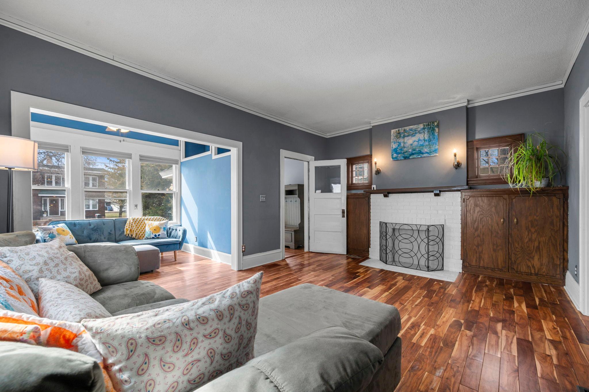 The living room serves as a spacious central gathering area, offering ample room for both everyday living and entertaining.