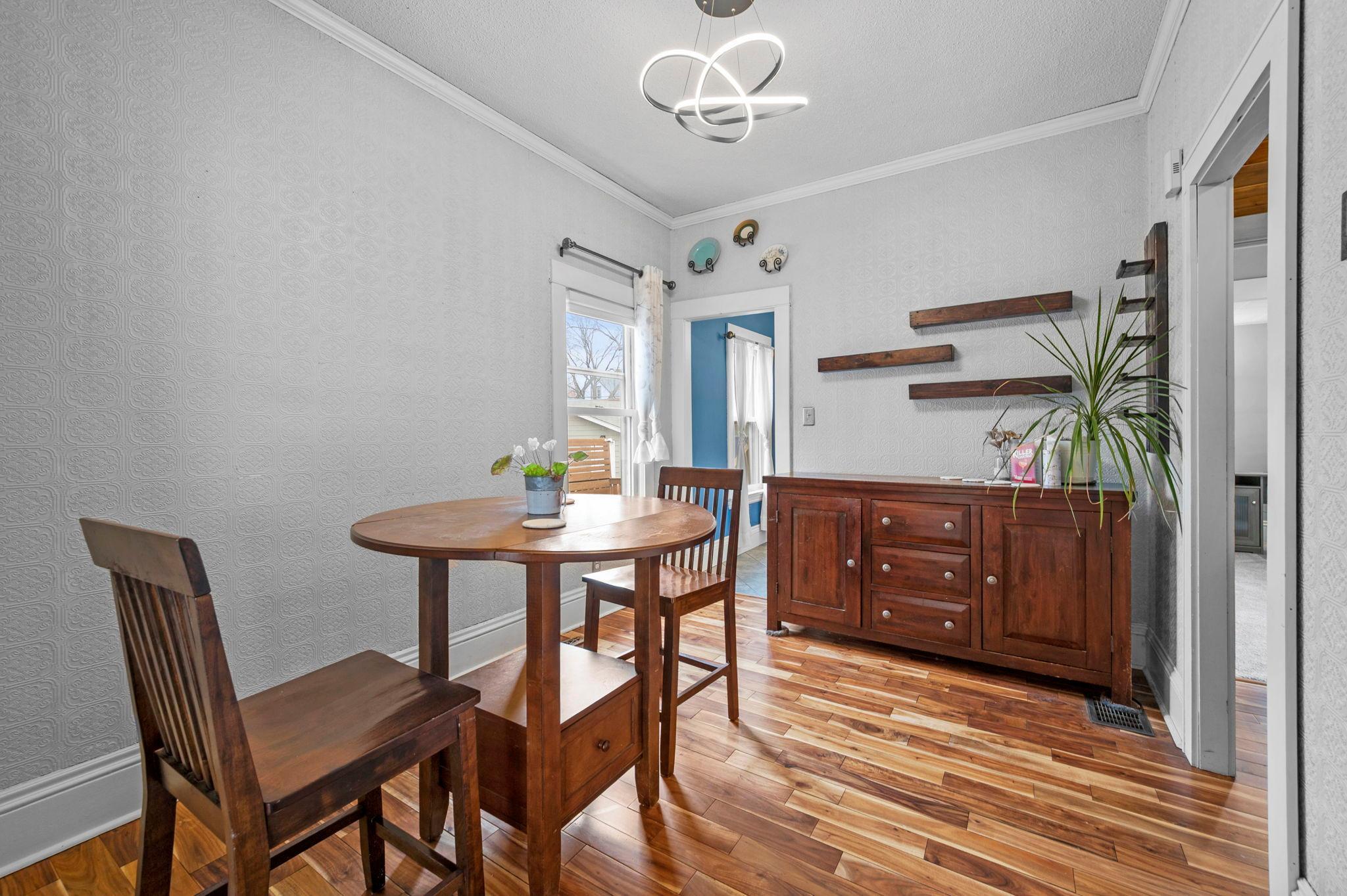 The dining room flows naturally between the living room and kitchen, providing an ideal layout for everyday living and hosting.