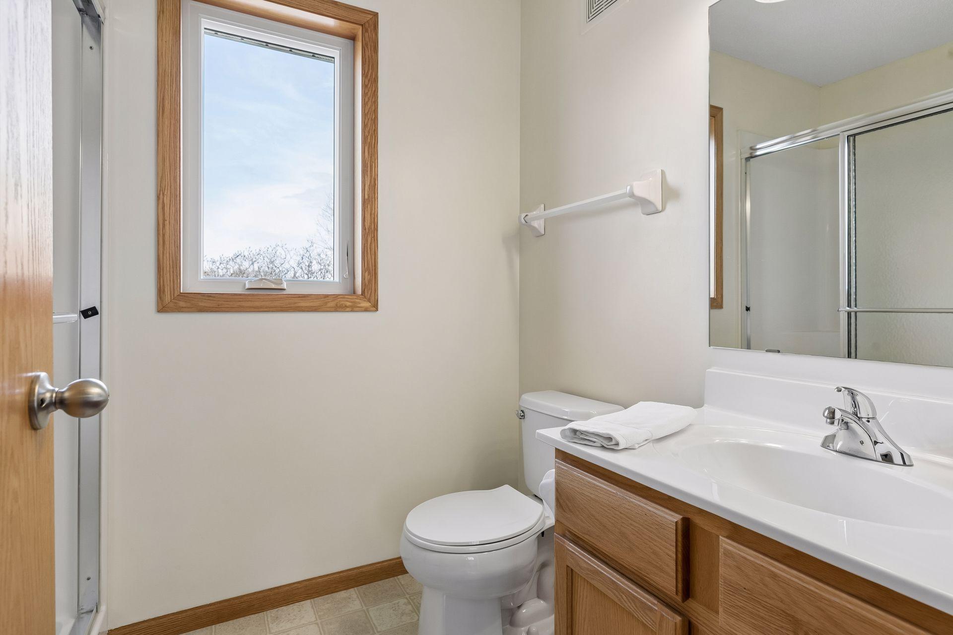 49 Windsor Wood Path - Primary suite features this 3/4 bathroom and adjacent walk-in closet.