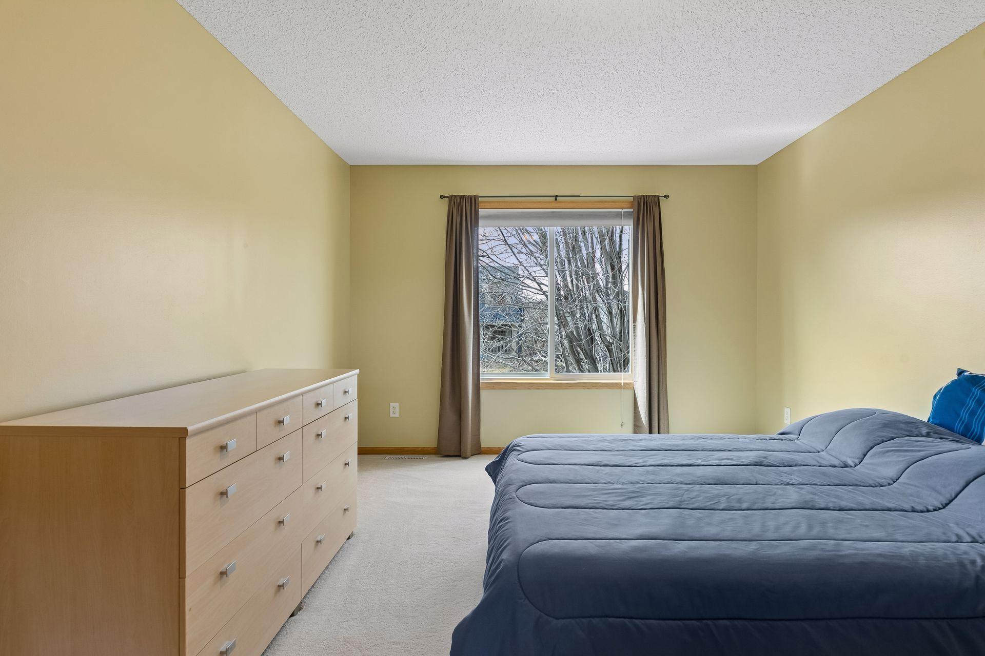 49 Windsor Wood Path - Primary suite with 3/4 bathroom and walk-in closet.