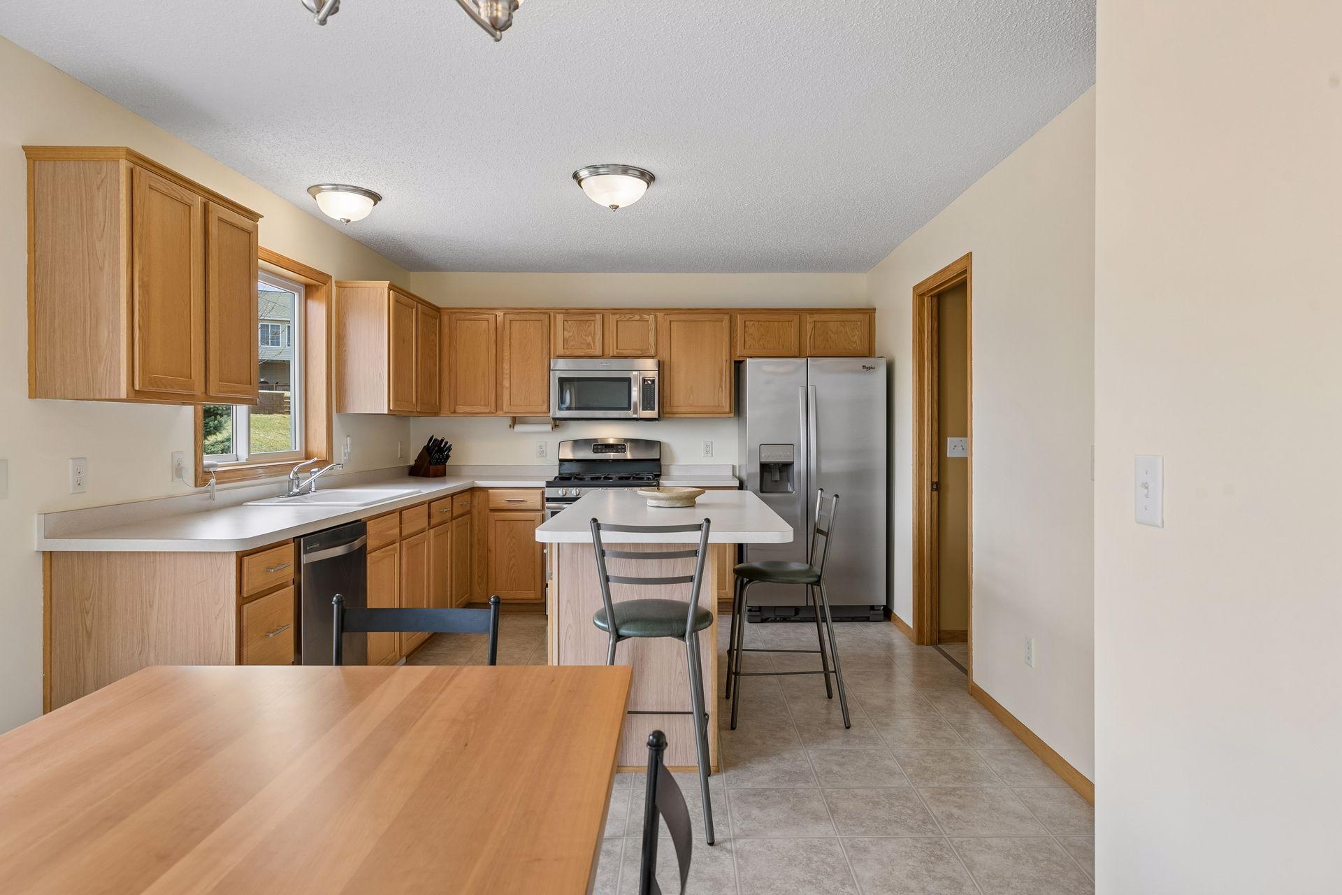 49 Windsor Wood Path - Spacious kitchen with island and stainless steel appliances