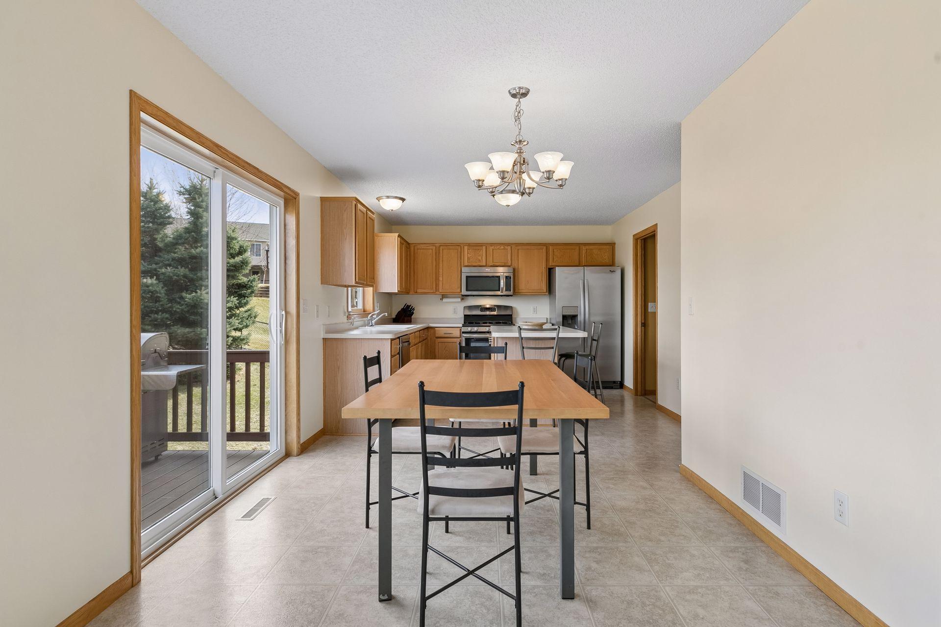 49 Windsor Wood Path - View from the living room area into the dining room and kitchen area overlooking the nice deck and backyard