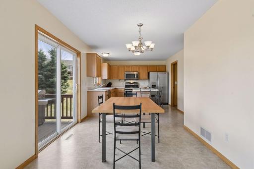 49 Windsor Wood Path - View from the living room area into the dining room and kitchen area overlooking the nice deck and backyard
