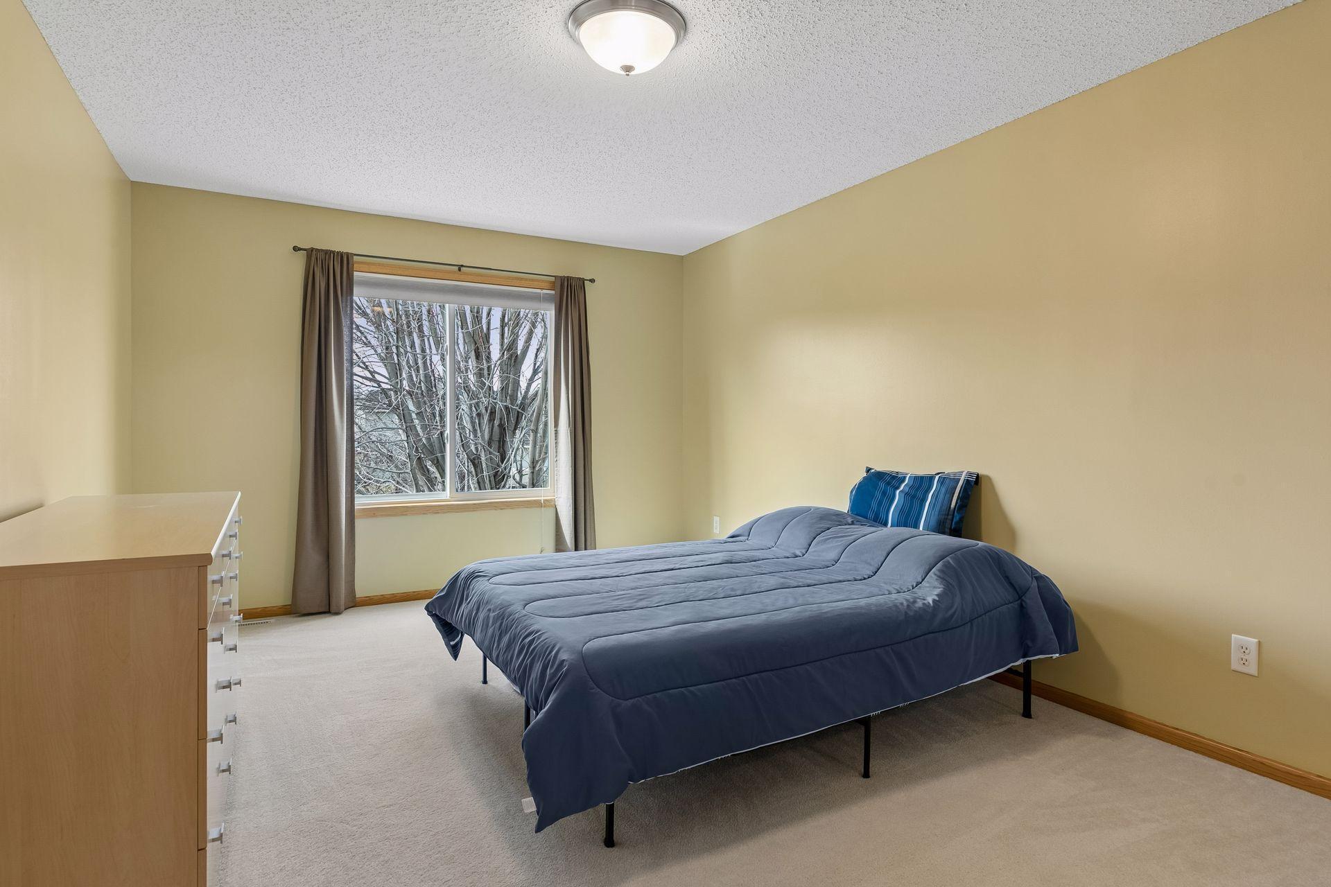 49 Windsor Wood Path - Primary suite with 3/4 bathroom and walk-in closet.