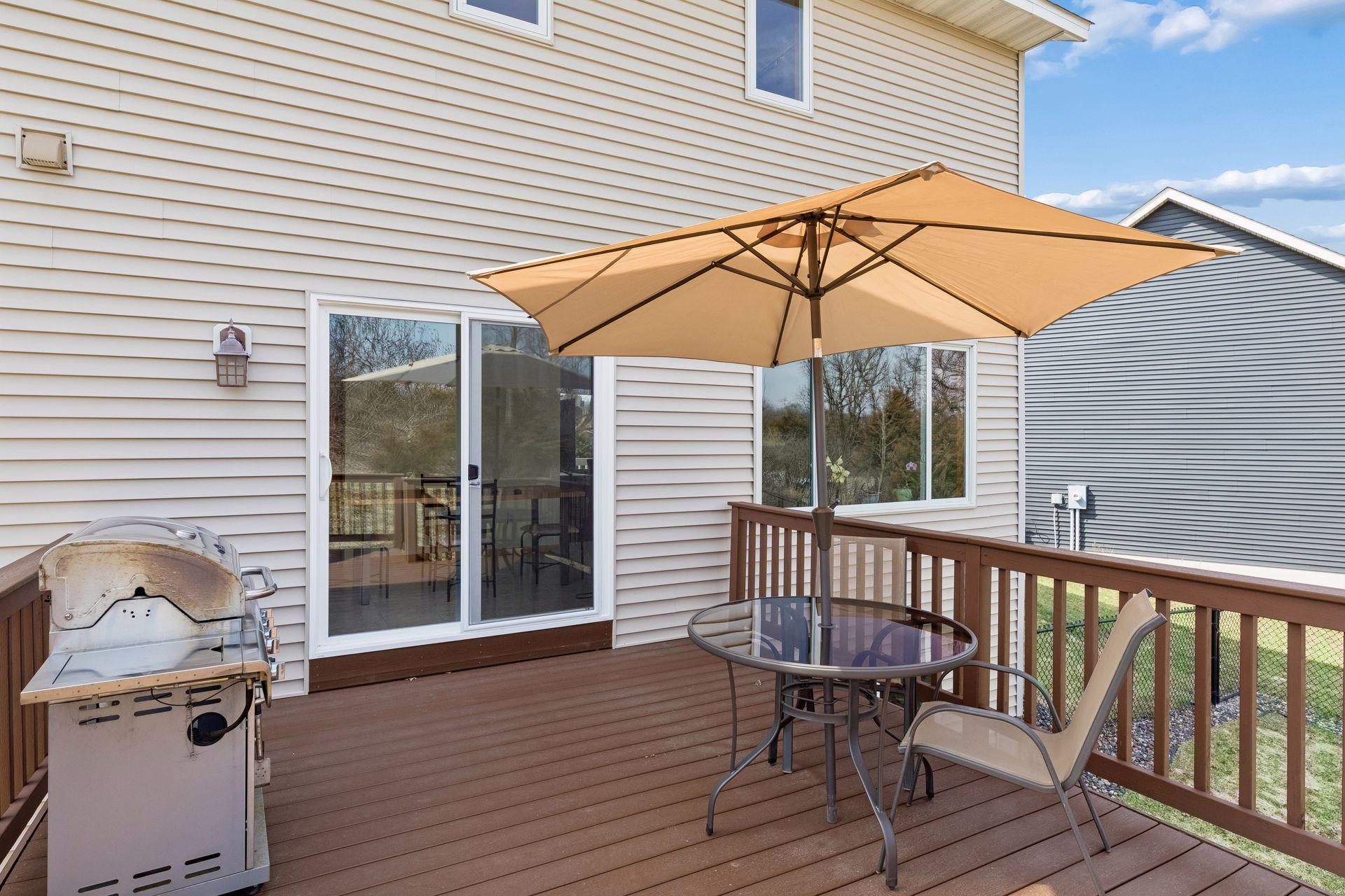 49 Windsor Wood Path - Large deck overlooking the scenic backyard with plenty of space for a grill and patio set to enjoy morning coffee or a book.