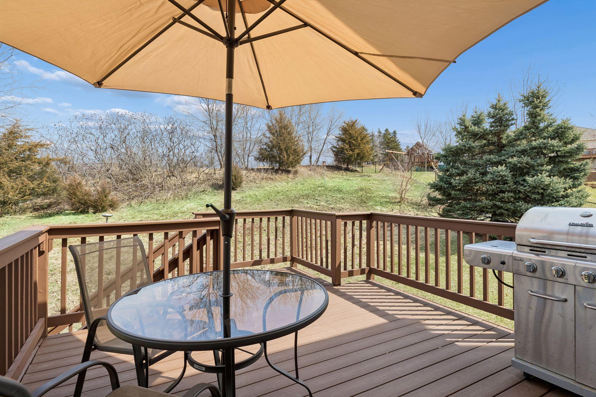 49 Windsor Wood Path - Large deck overlooking the scenic backyard with plenty of space for a grill and patio set to enjoy morning coffee or a book.
