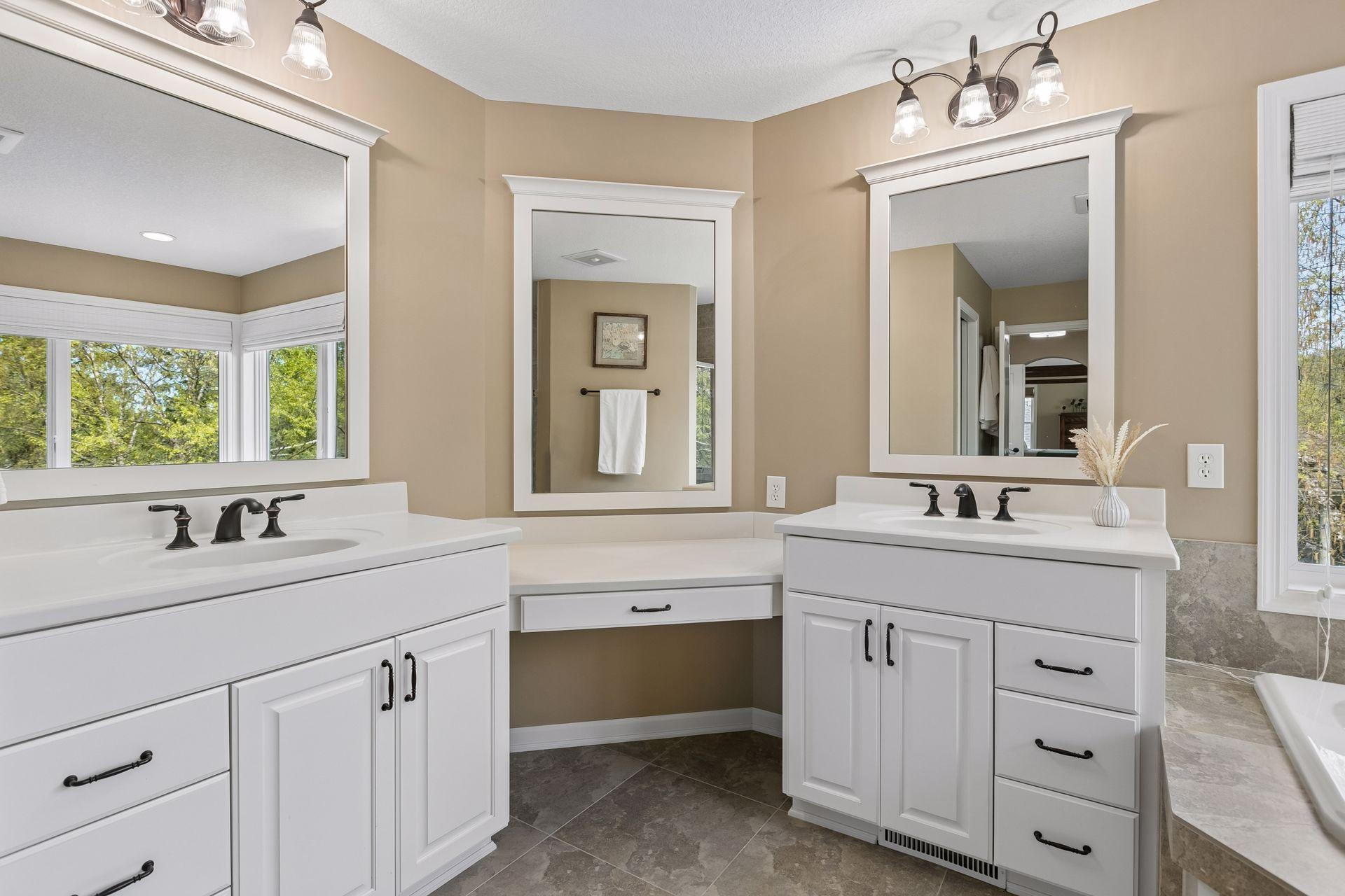 Double vanities and make-up counter in primary bathroom