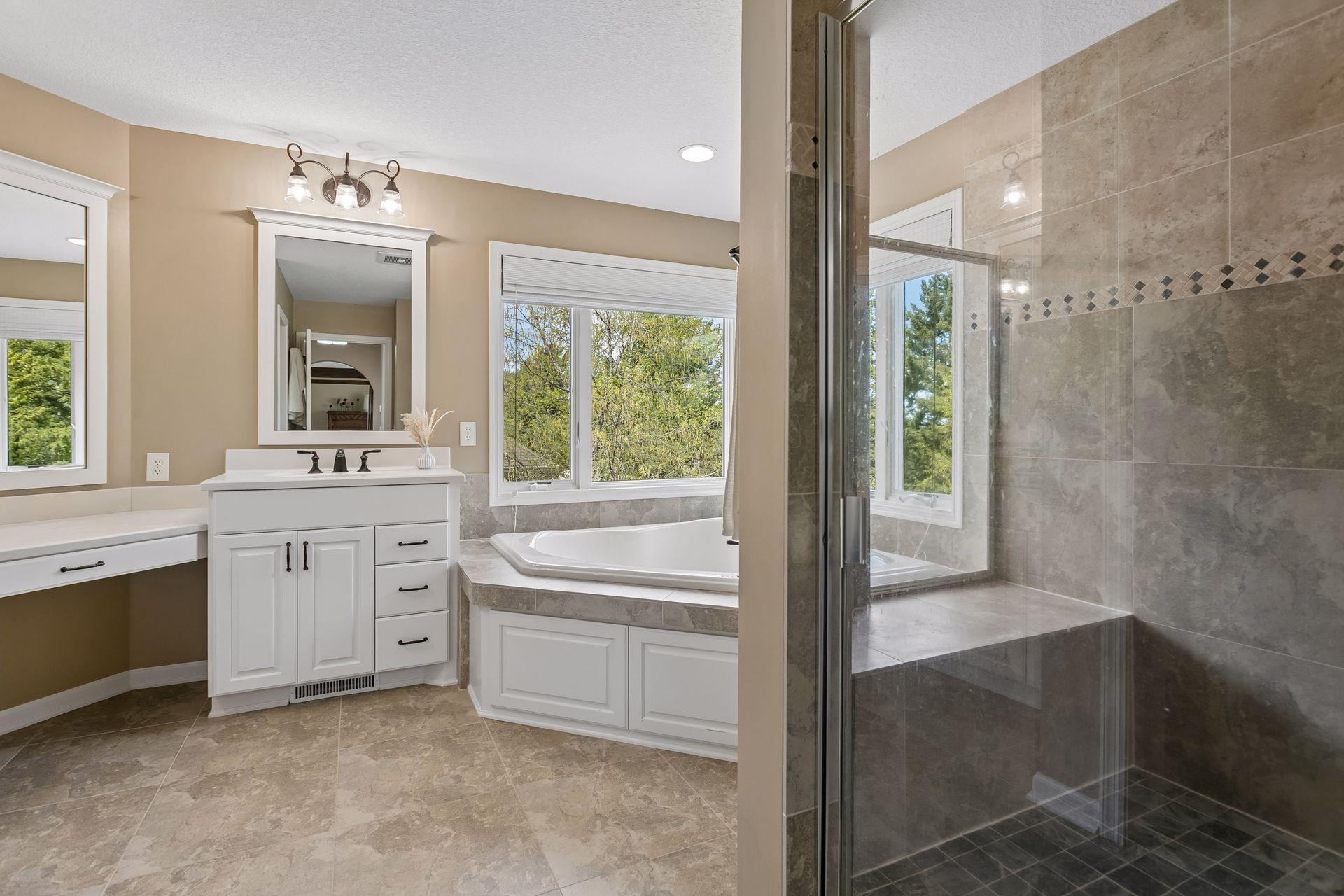 Separate tub and shower with corner windows for natural light