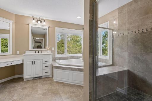 Separate tub and shower with corner windows for natural light