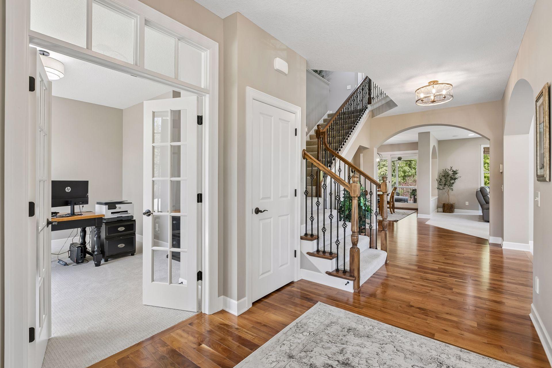 French doors in foyer lead you to the main floor den