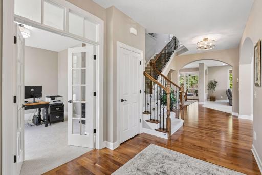 French doors in foyer lead you to the main floor den