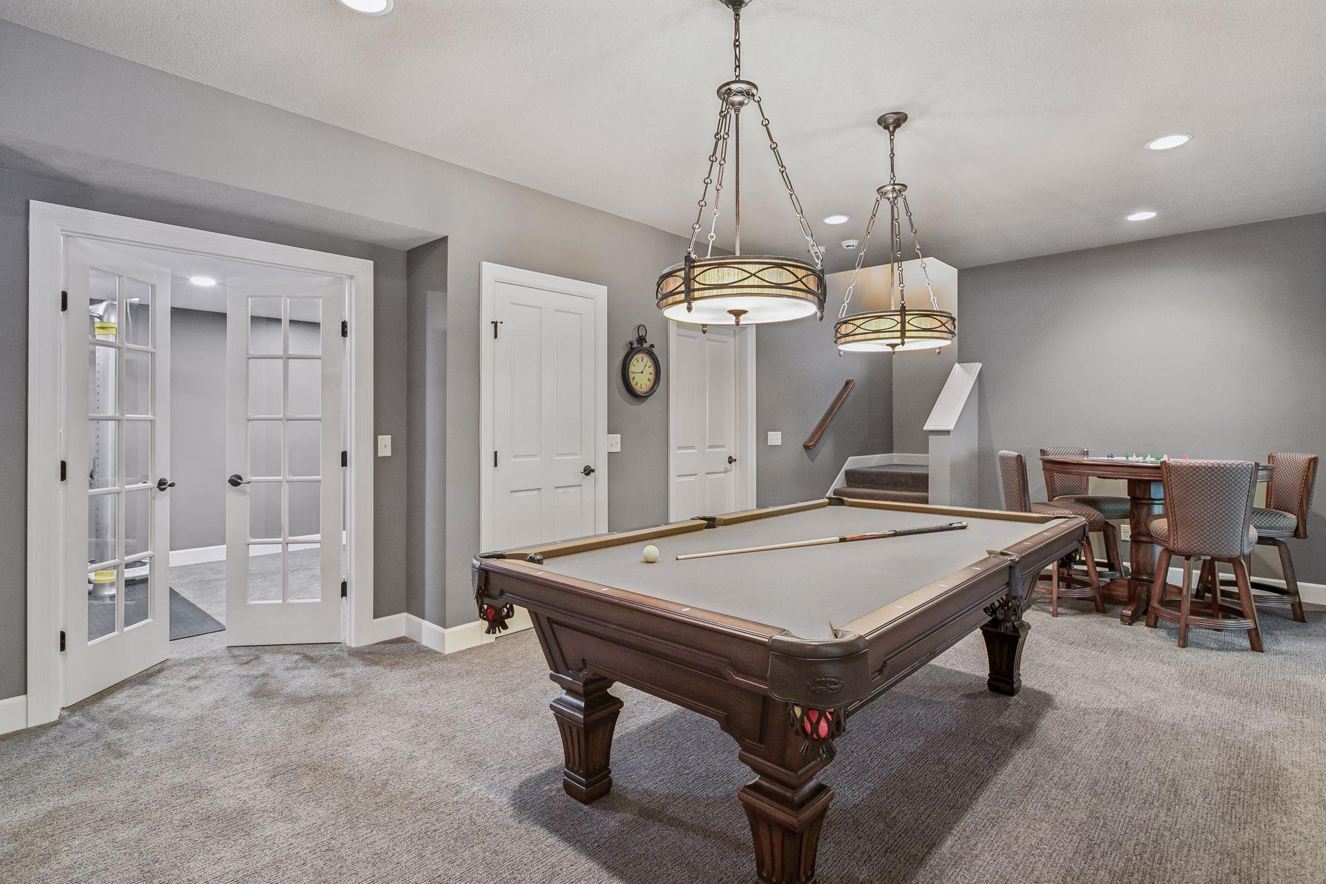 Glass French doors off of game room to the flex/exercise room
