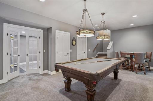 Glass French doors off of game room to the flex/exercise room