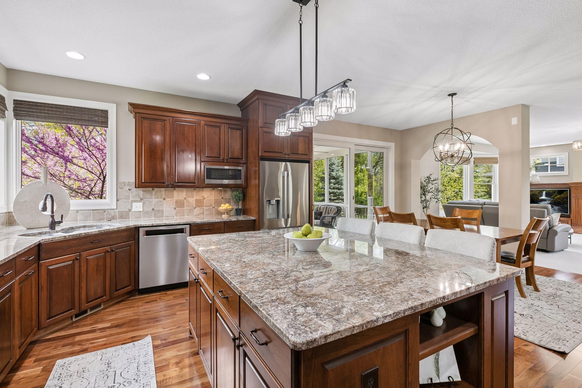 Enjoy the screen porch and grilling deck off of the kitchen/dining area