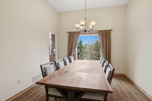 Formal dining room with large window and room for everyday or special occasion meals
