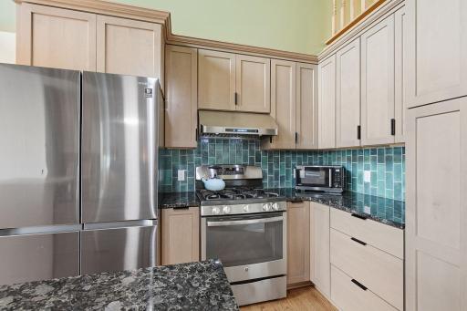 Kitchen view featuring stainless steel appliances and generous cabinet storage