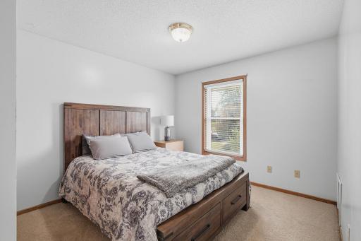 Upper-level bedroom #4 with large window and versatile layout