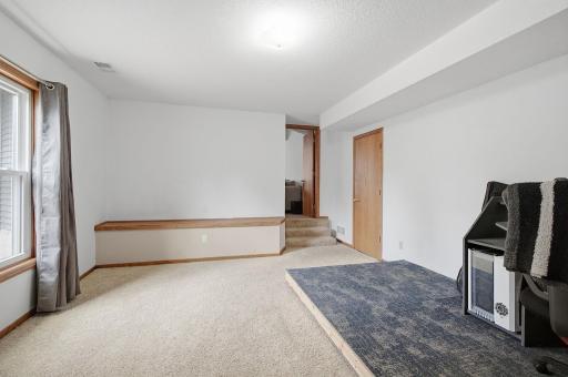 Lower-level transition space with access to storage and utility areas