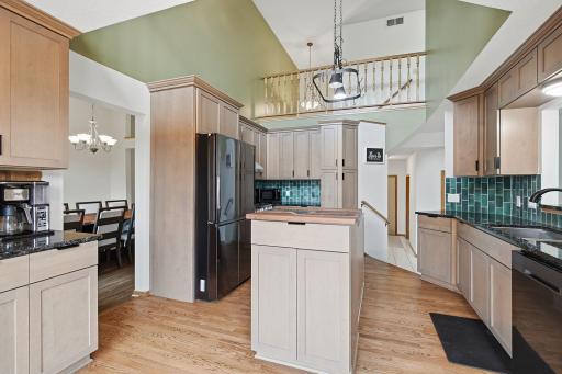 Kitchen with center island and convenient connection to nearby dining space