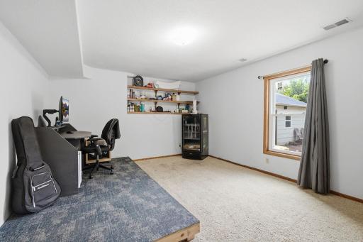 Lower-level den or office space with built-in shelving