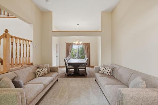 Main-level living room flows nicely into the formal dining area