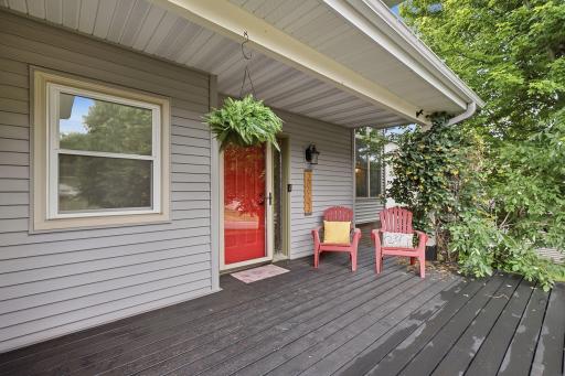 Covered front porch creates an inviting place to relax and enjoy the setting