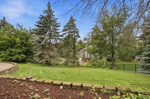 Mature backyard setting with trees and green space