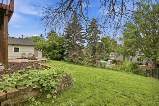 Backyard with mature trees, landscaping, and room to enjoy the outdoors