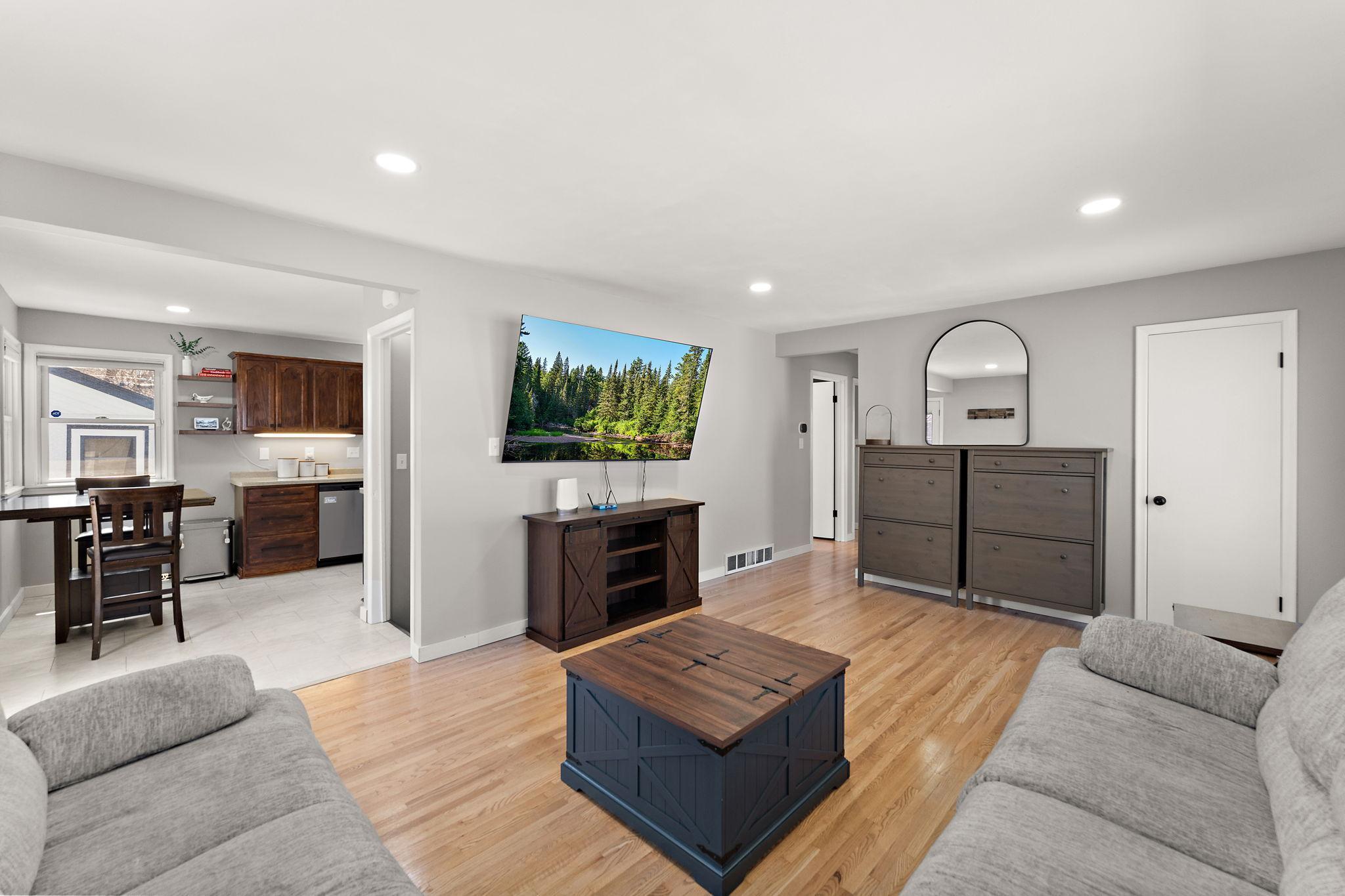 The living room is right off of the informal dining area and has newly refinished hardwood floors. The entire main floor interior also has been recently painted.