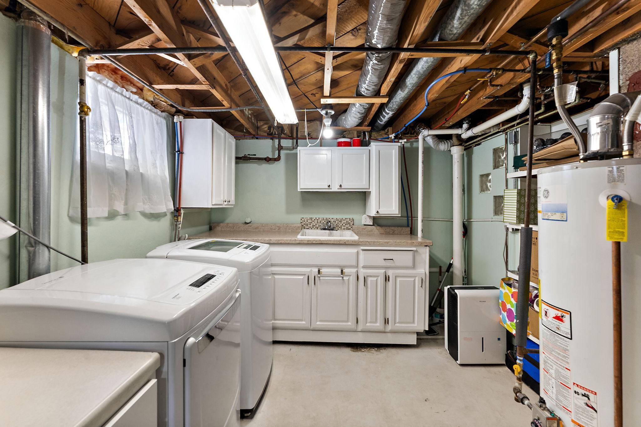 The lower level utility room with washer and gas dryer.
