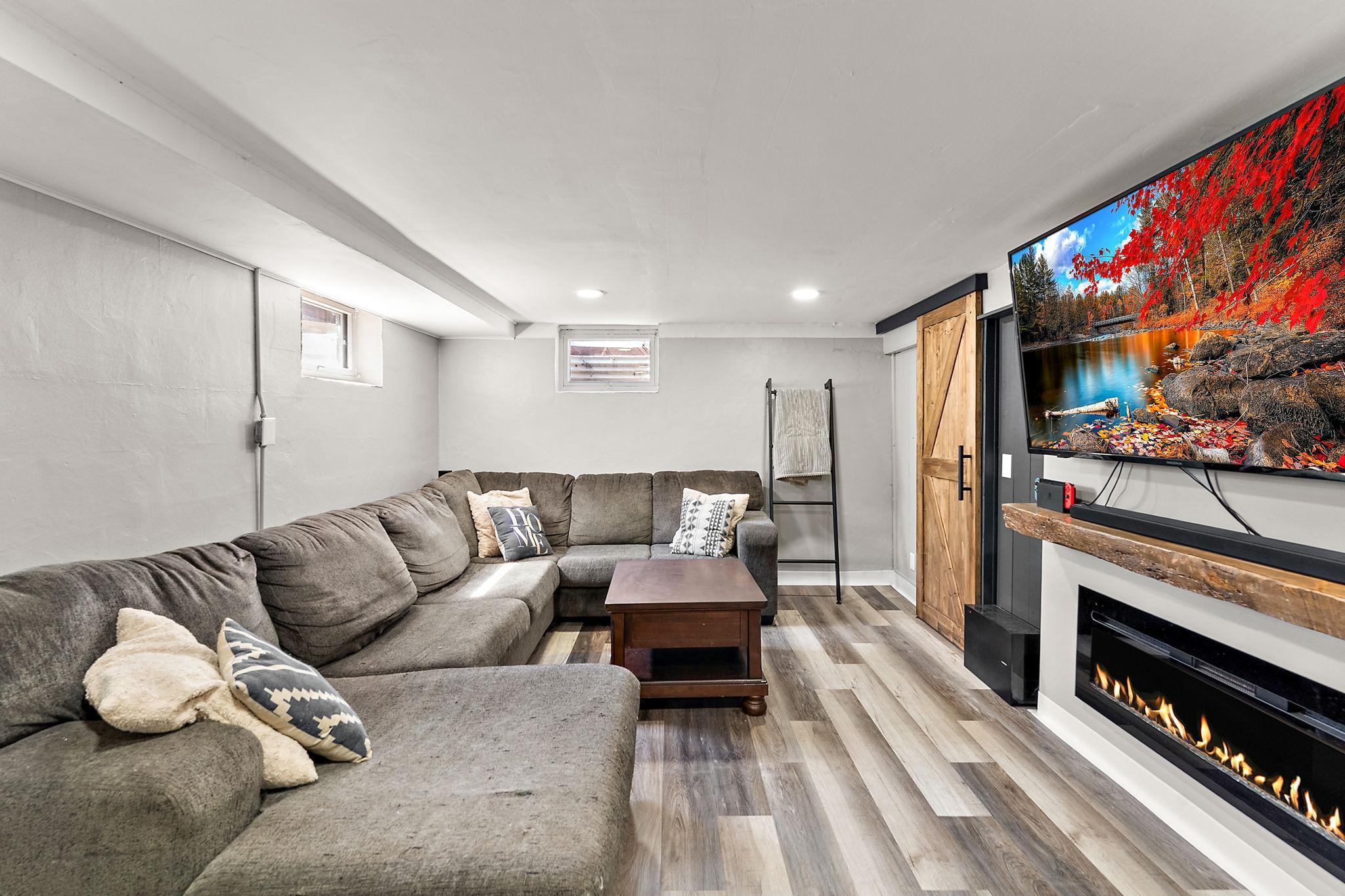 The lower level also has been newly painted with newly installed flooring and a new electric fireplace, making this space ideal for entertaining or relaxing on cool evenings.