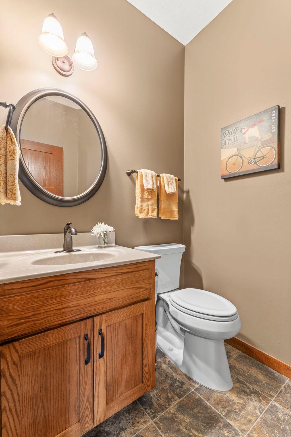 Main floor powder bath with tile floors