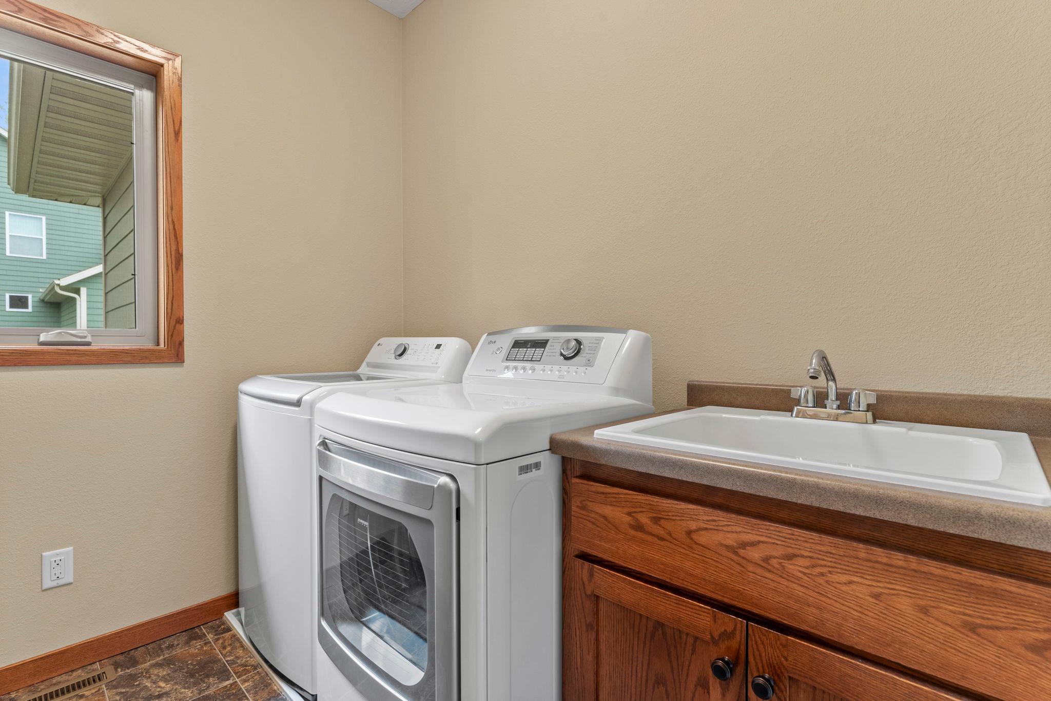 Convenient main-floor laundry room with a sink