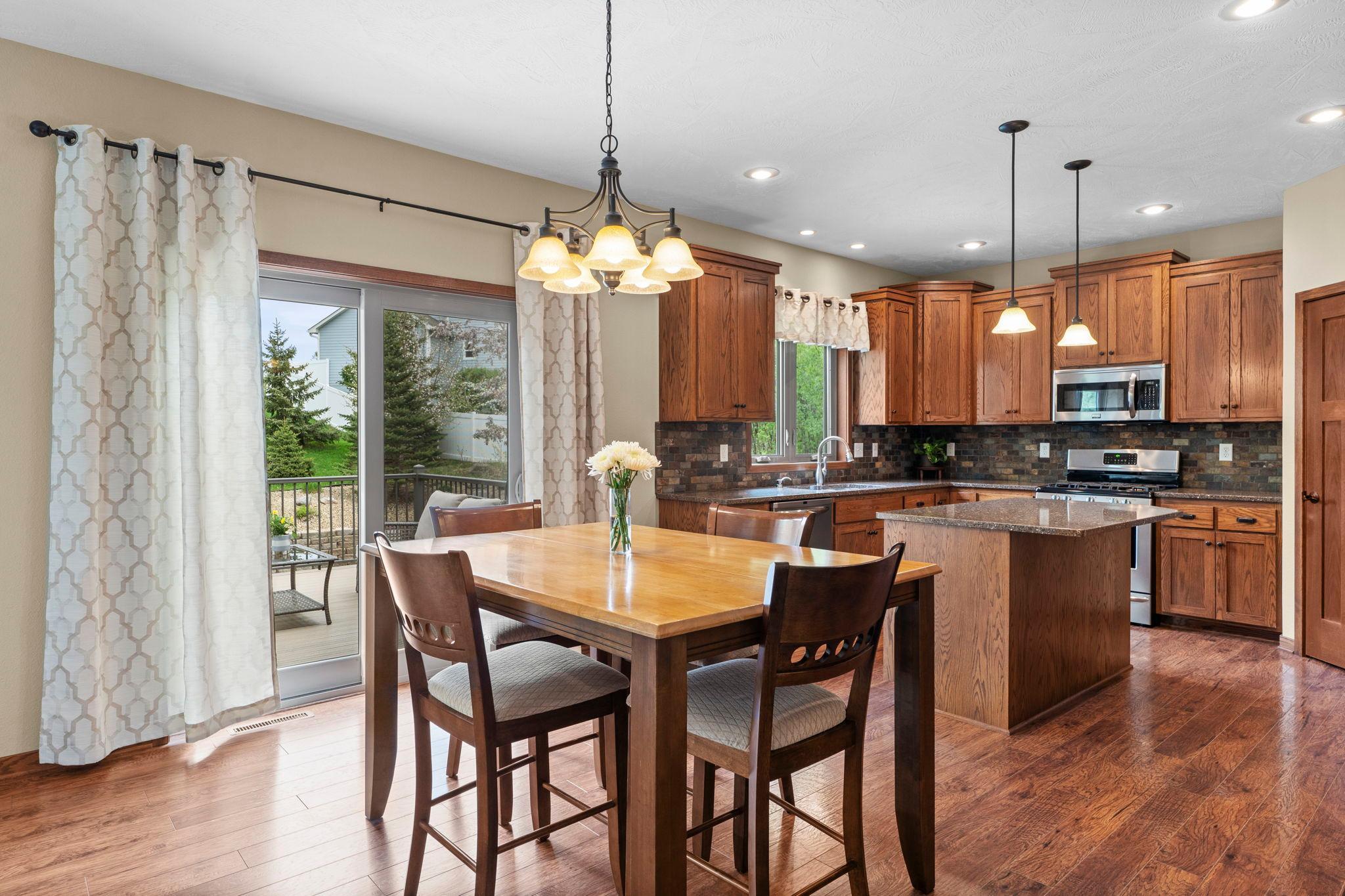 Warm and inviting kitchen and dining room, accented by beautiful hardwood floors