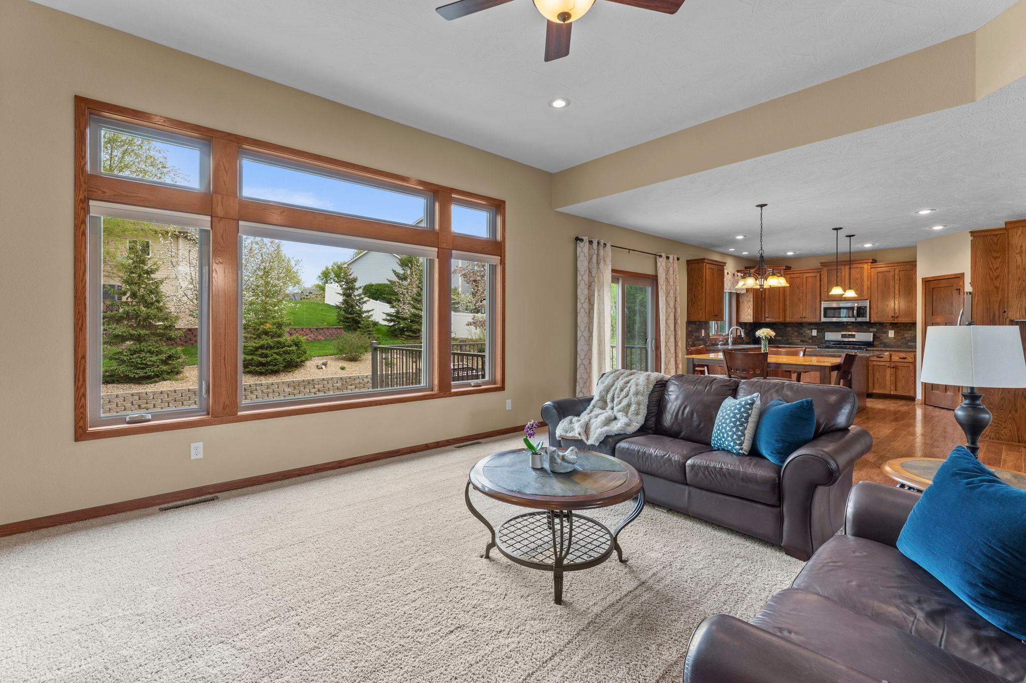 Open concept living in this rambler, offering sweeping views of the backyard